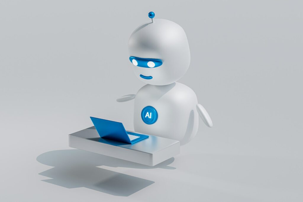 Weißer Roboter mit blauen Augen neben einem Laptop