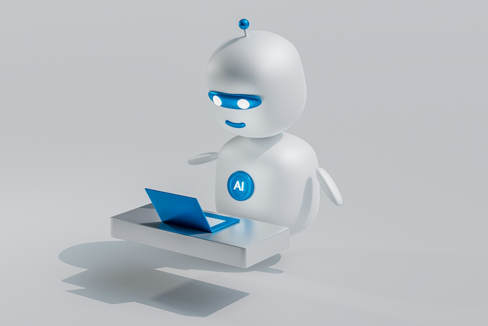 Weißer Roboter mit blauen Augen neben einem Laptop